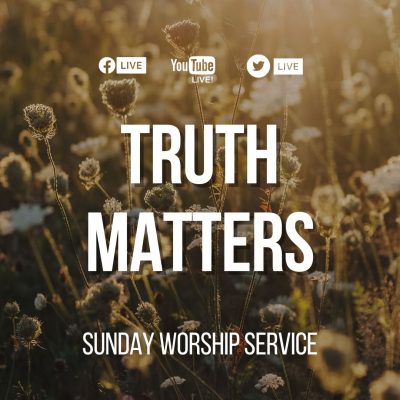 Truther matters sign over the summer field